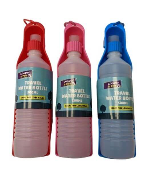 Travel water bottle for dogs. Bottle drains into holder for easy drinking on the go.