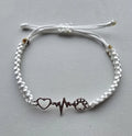Handmade macrame bracelet. Adjustable size. Heart to dog or cat paw jewellery.